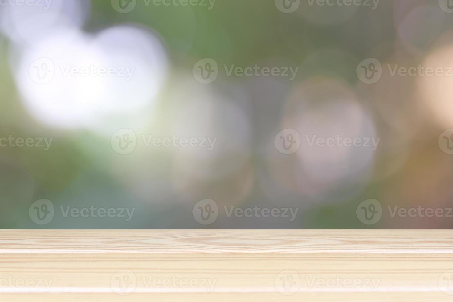 Empty wooden table with light bokeh in garden space background montage style, For place the product. photo