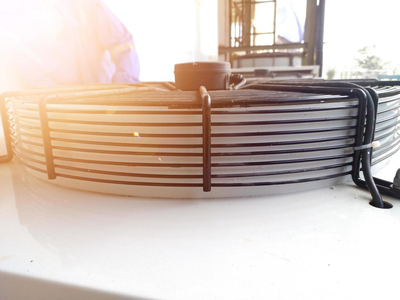 The Close up View of Metal Ventilation Fan not rotating with the shine light. photo