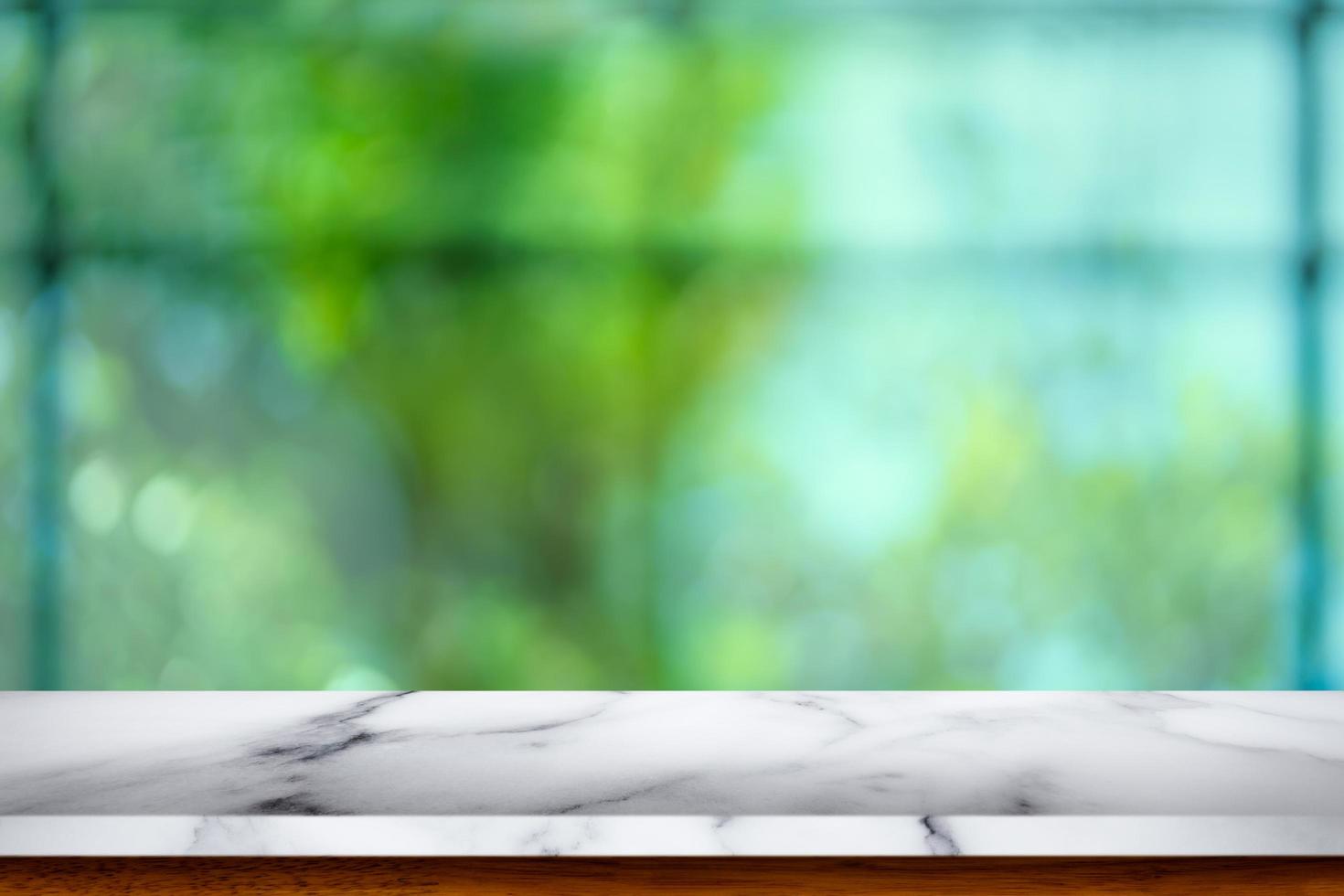 Empty white marble table with blur cafe background. photo