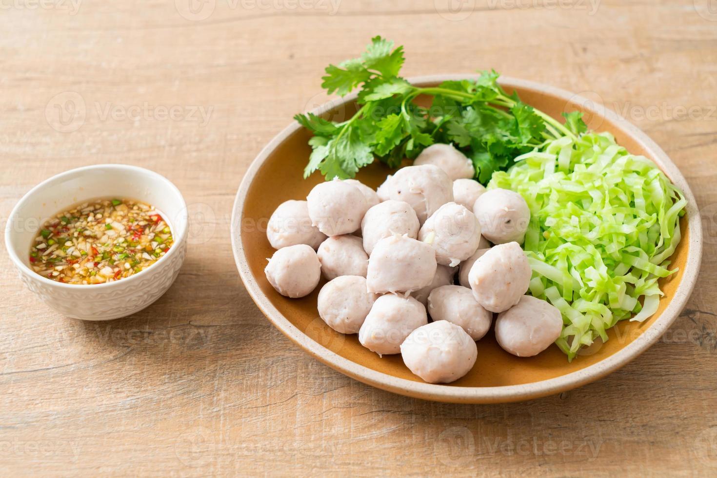 pork meatball with vegetable and spicy sauce photo