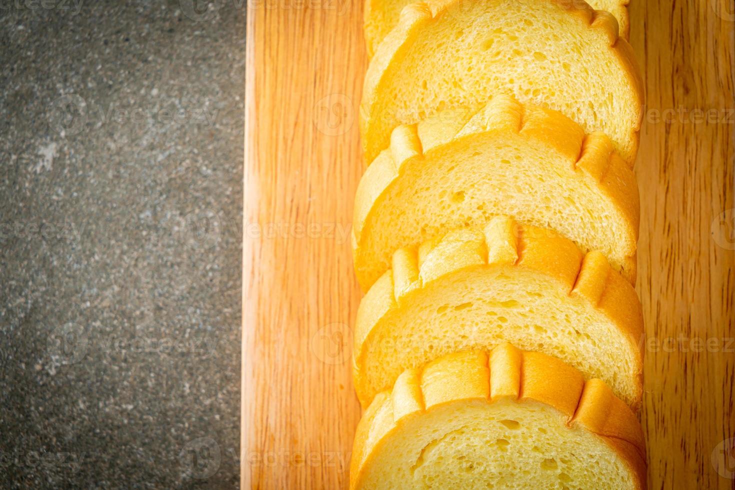 potatoes bread sliced on wood board photo