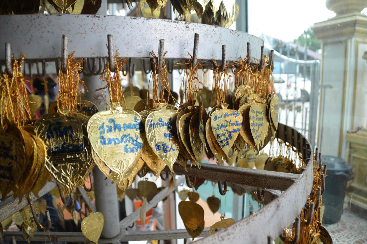 Many golden bodhi leaves are decorated in Thai temples, making merit according to belief and truth. photo