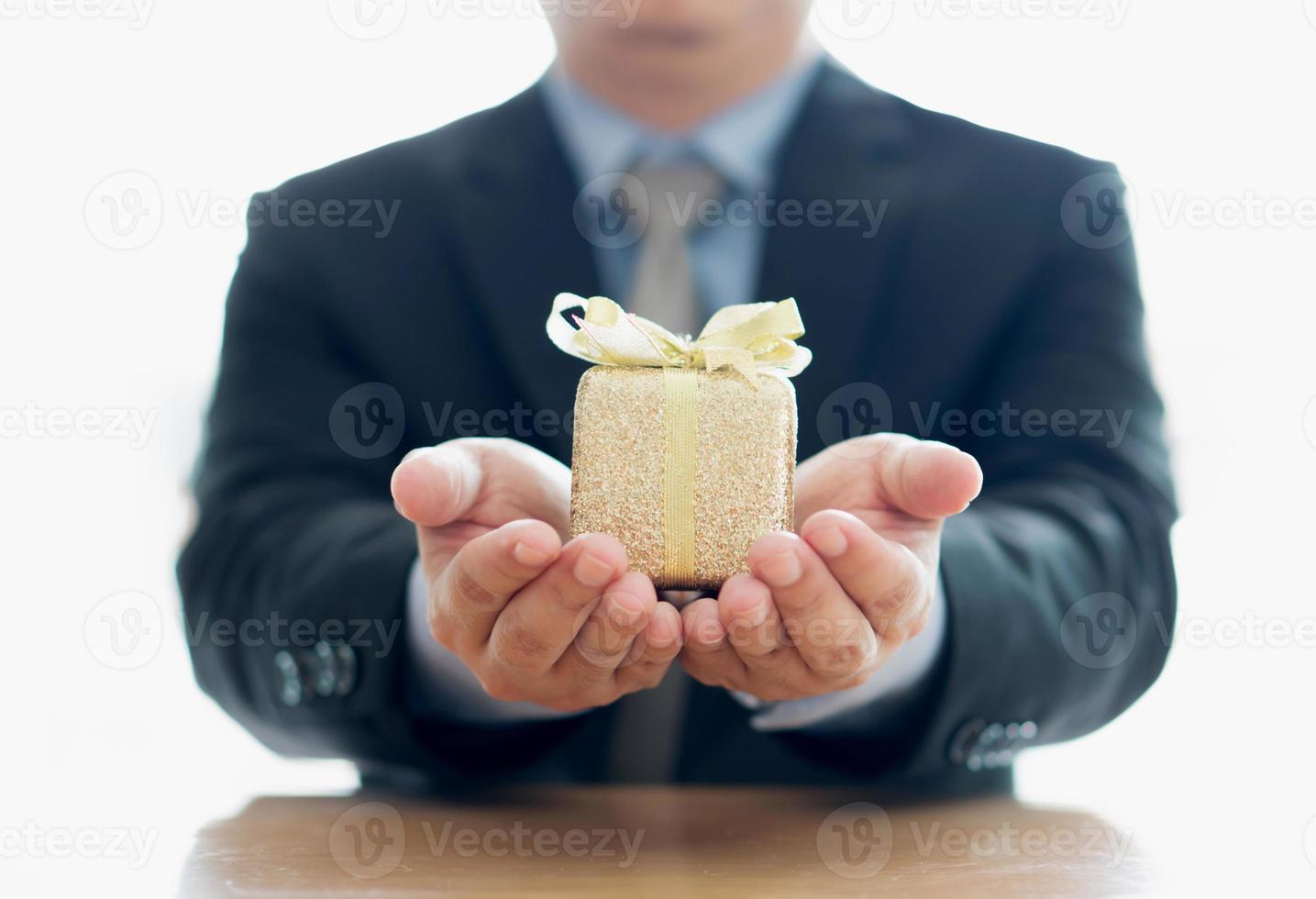 Close up of man with blue present box photo
