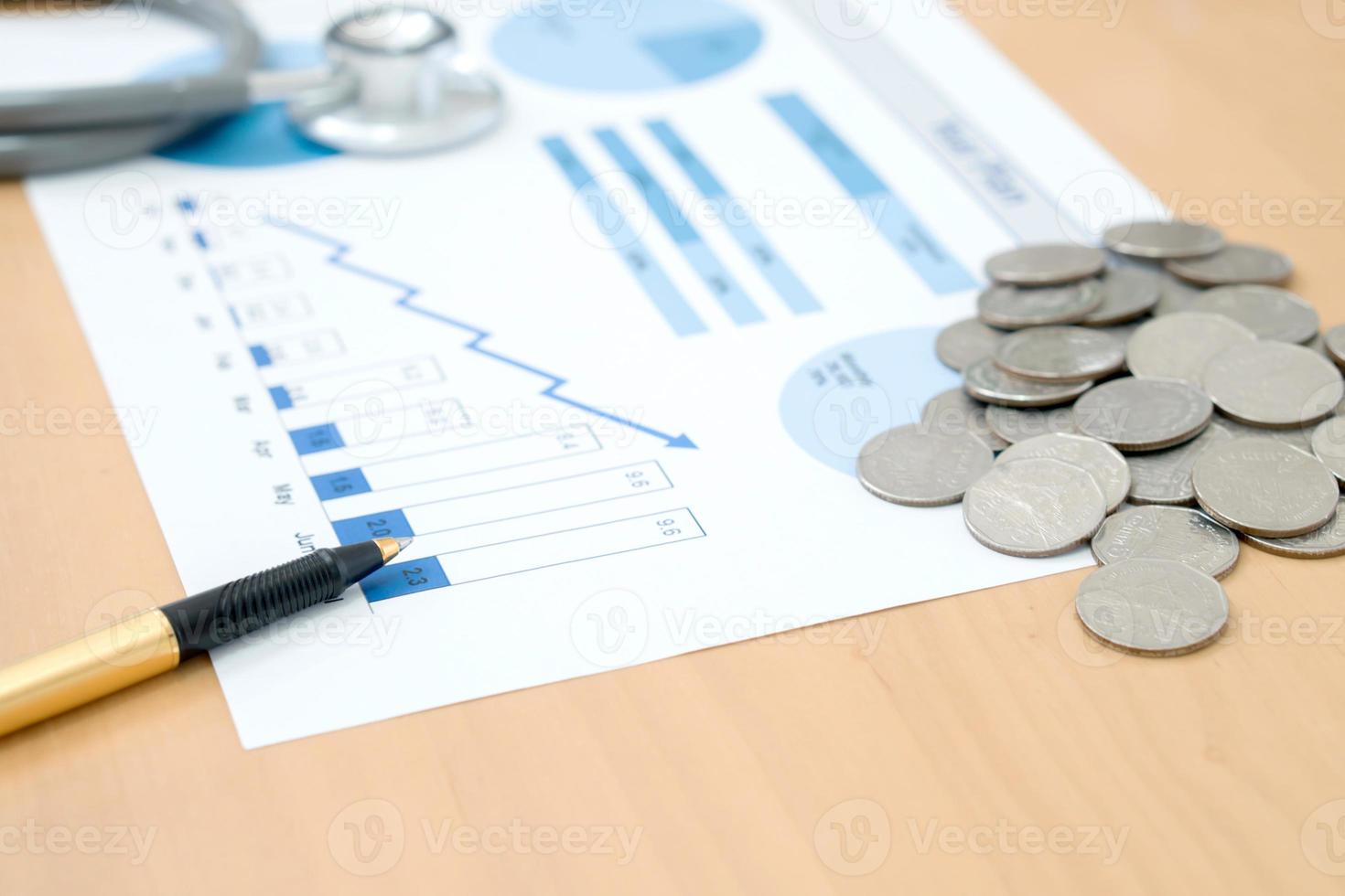 money coins with stethoscope checking photo