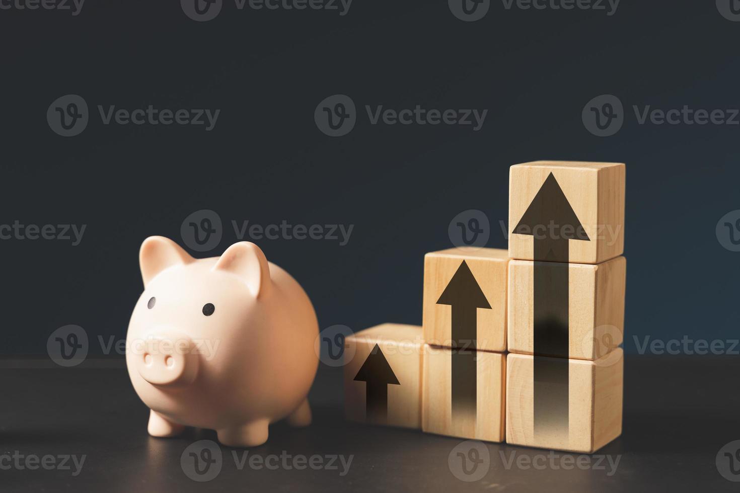 piggy bank and stacking wood block.money saving concept photo