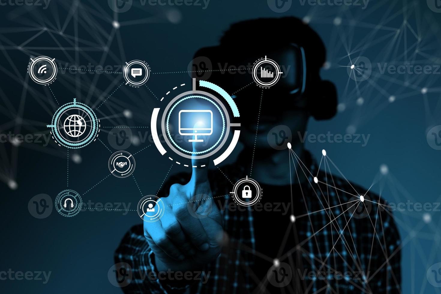 Man using vr headset touching a holographic screen photo
