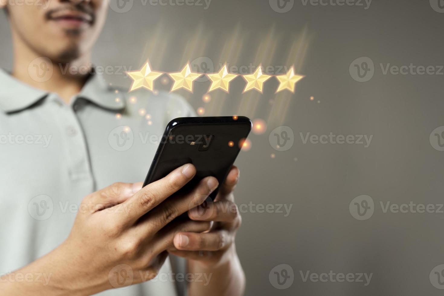 Customer with smartphone show 5 stars virtual screening monitor satisfaction photo