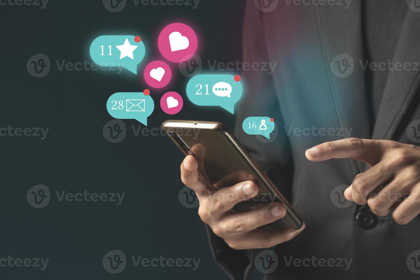 Person using a social media marketing concept on mobile phone with notification icons of like, message photo