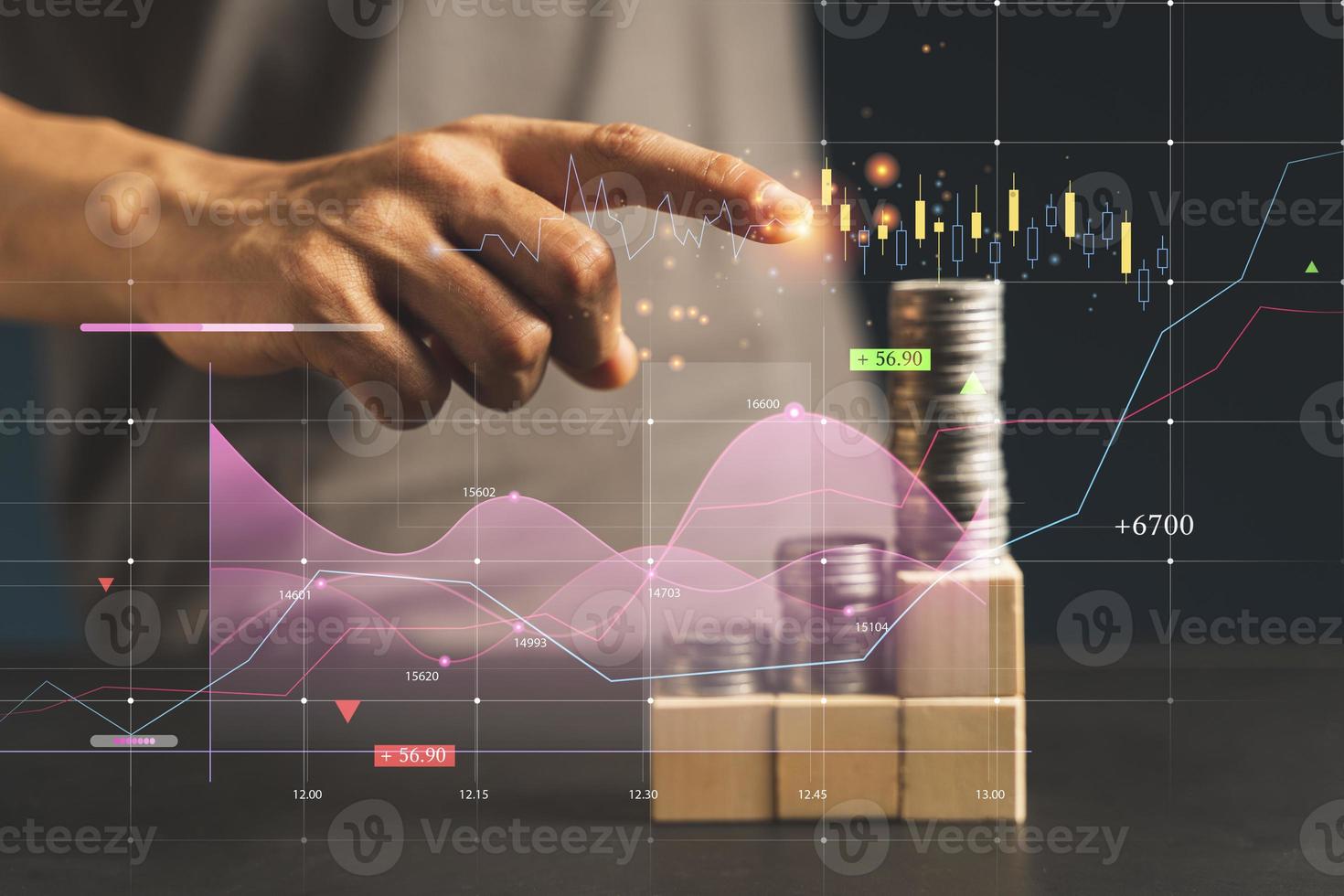 Bbusinessman try to arrange wooden blocks and coin into growing graphs photo