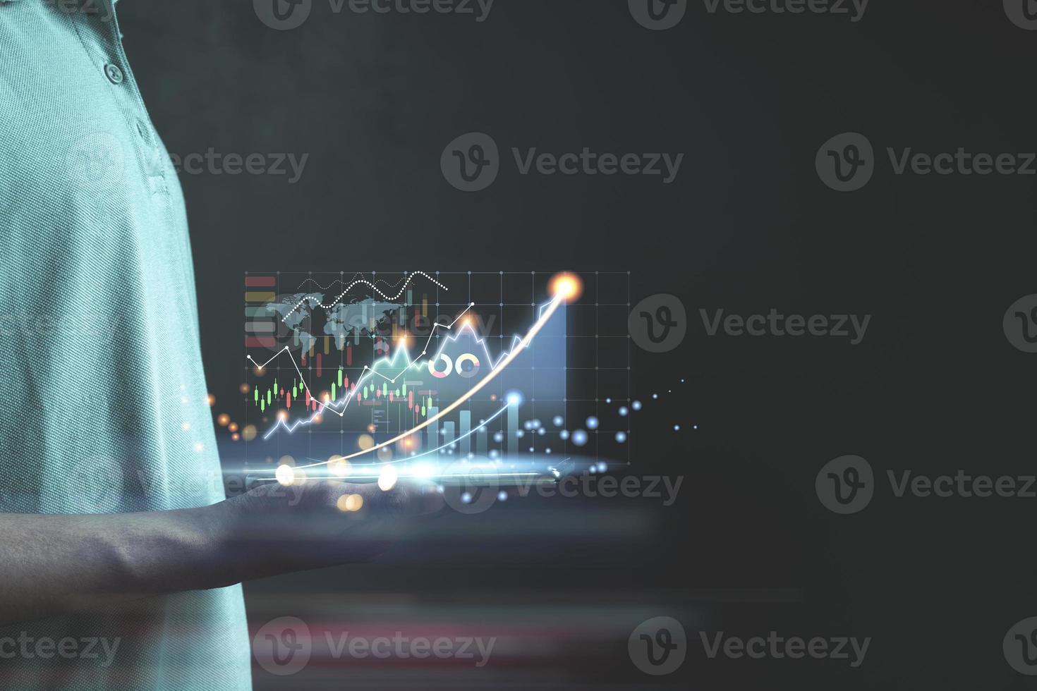 Businessman or trader is showing a growing virtual hologram stock photo
