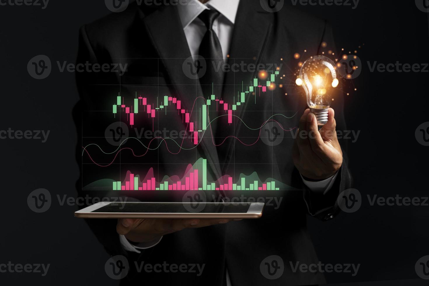 planning business and financial concept. Businessman holding virtual screen on growth graph chart and data photo