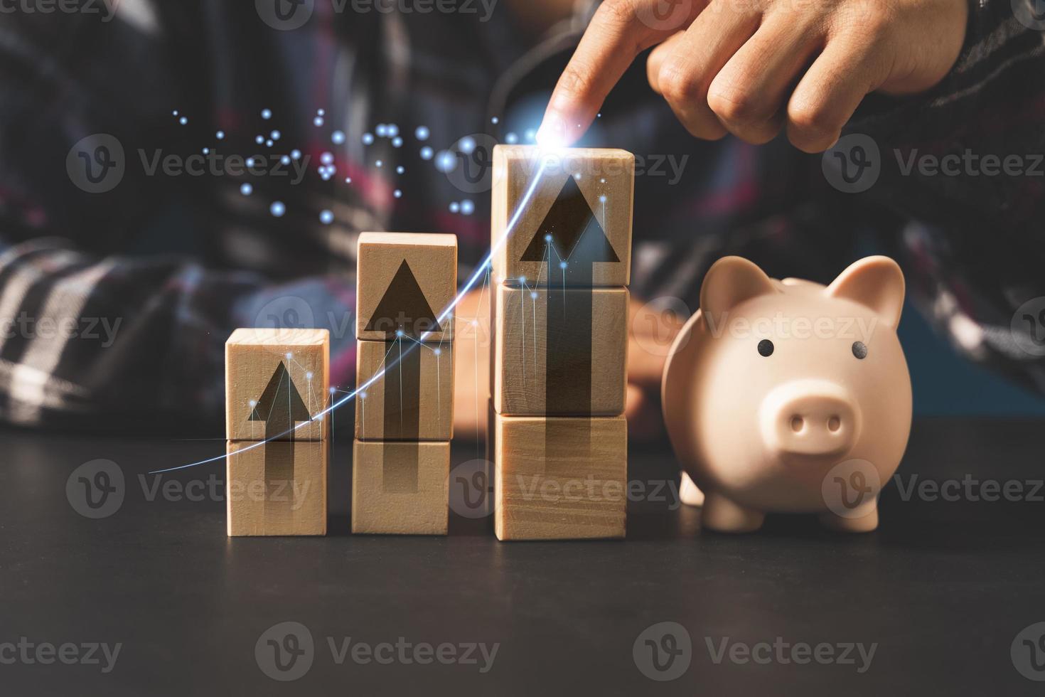 piggy bank and stacking wood block.money saving concept photo