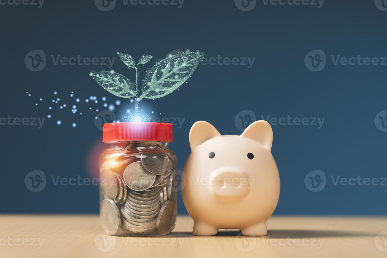 piggy bank with coin and leaves on wooden table, saving money concept photo
