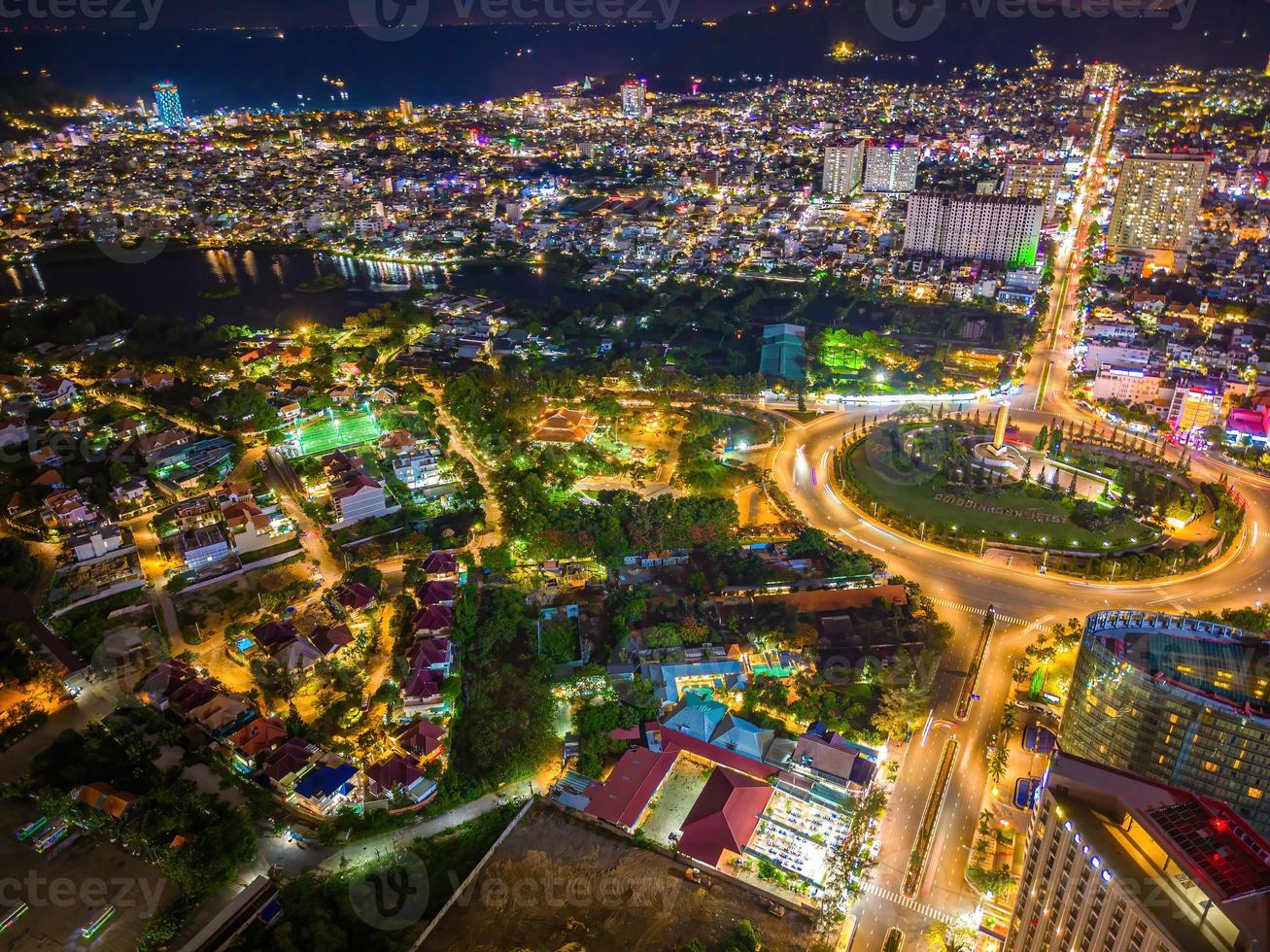 Panoramic coastal Vung Tau view from above, with traffic roundabout, house, Vietnam war memorial in Vietnam. Long exposure photography at night. photo