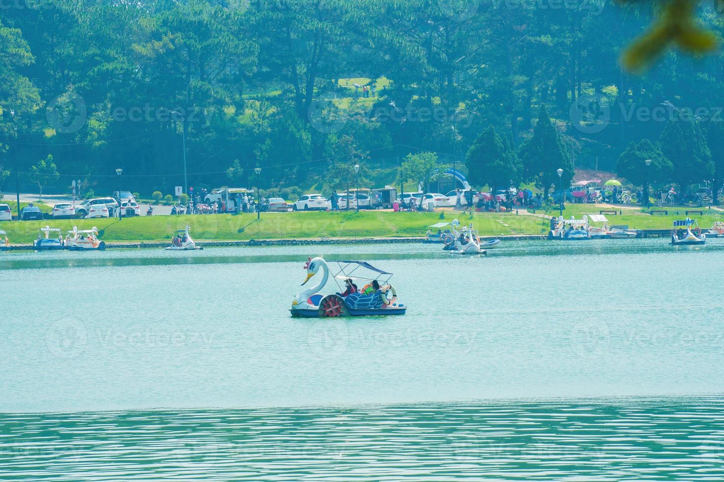 Fabulous sunrise by Xuan Huong Lake, in center Da Lat City, Lam Dong Province, Vietnam. This artificial lake in the city centre is a favourite place for tourists and locals for walking. photo