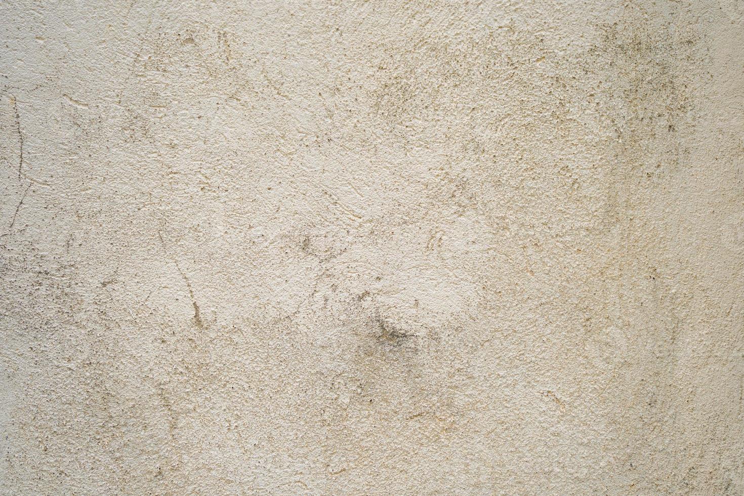 textura del antiguo muro de hormigón gris para el fondo. textura áspera en la pared gris forma áspera debido a la capa de pintura descascarada debido a la lluvia foto