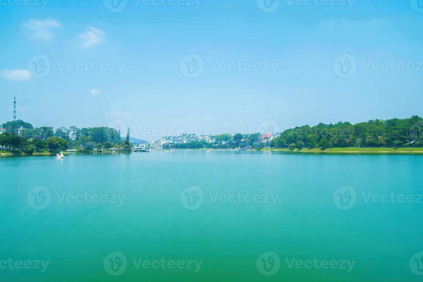 Fabulous sunrise by Xuan Huong Lake, in center Da Lat City, Lam Dong Province, Vietnam. This artificial lake in the city centre is a favourite place for tourists and locals for walking. photo