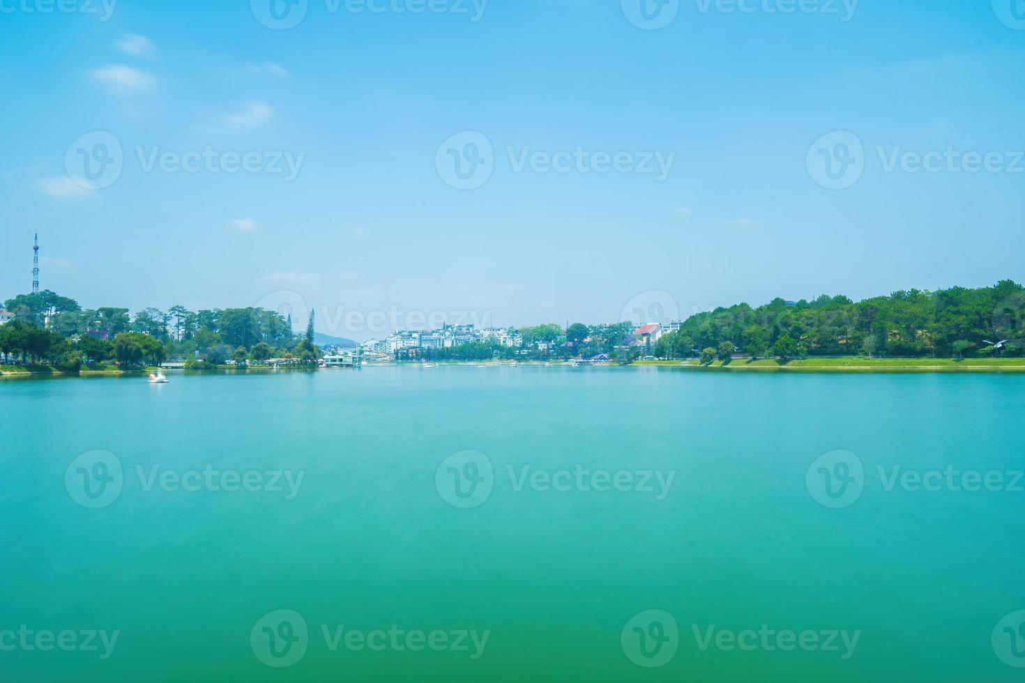 Fabulous sunrise by Xuan Huong Lake, in center Da Lat City, Lam Dong Province, Vietnam. This artificial lake in the city centre is a favourite place for tourists and locals for walking. photo
