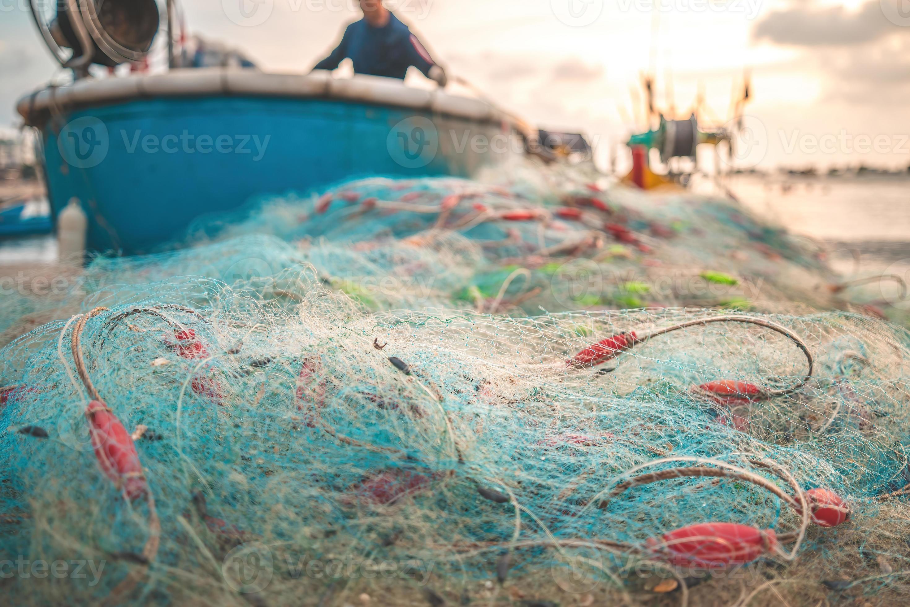 Sea nets - fishing equipment or tackle as texture backdrop with natural  sunlight and shadow. Blue textured background of fishing nets close-up,  marine design for craft of fishermen. 8356278 Stock Photo at