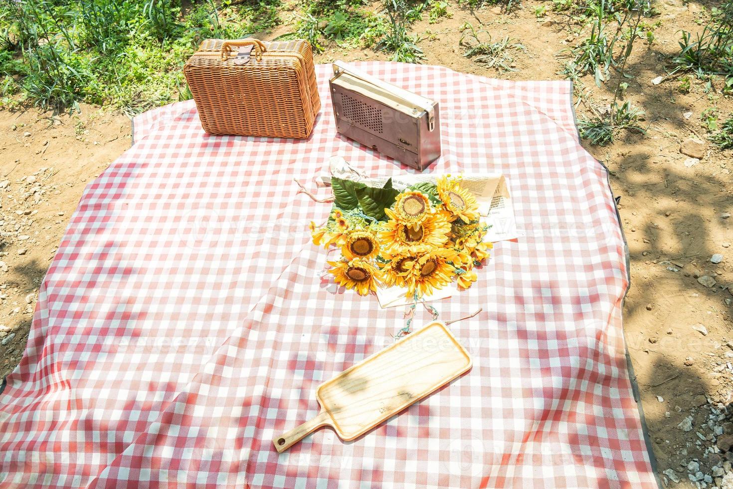 Beautiful white decor in boho style. Picnic in nature, table, carpets, wigwam, tent, pillows in the park. Celebration after quarantine. photo