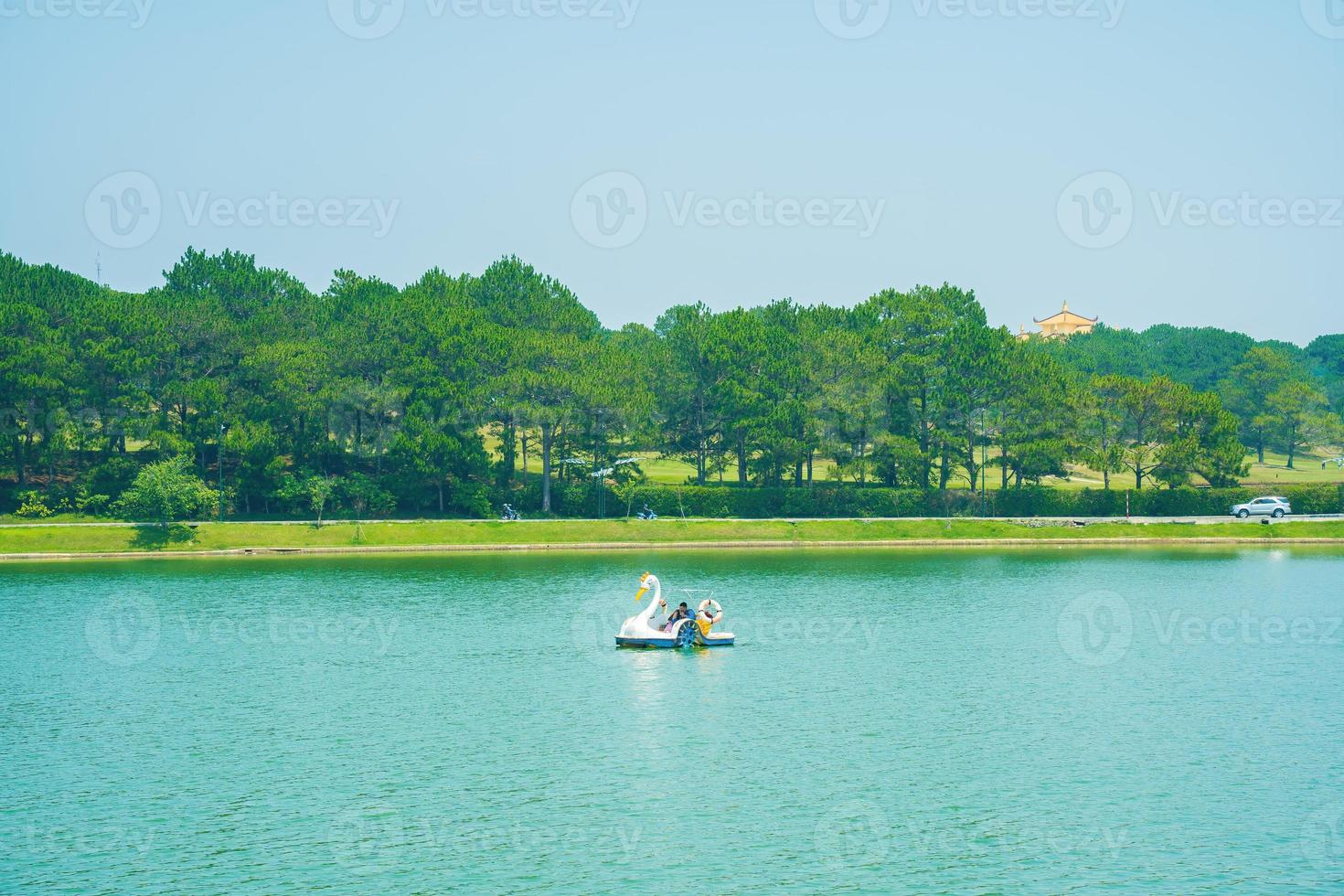 Fabulous sunrise by Xuan Huong Lake, in center Da Lat City, Lam Dong Province, Vietnam. This artificial lake in the city centre is a favourite place for tourists and locals for walking. photo