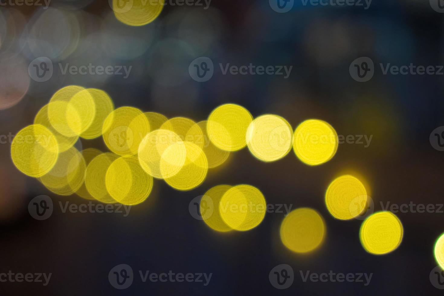 Night city bokeh glows light background empty. Banner candlelight shines yellow gold glitter abstract. Design background Celebration photo