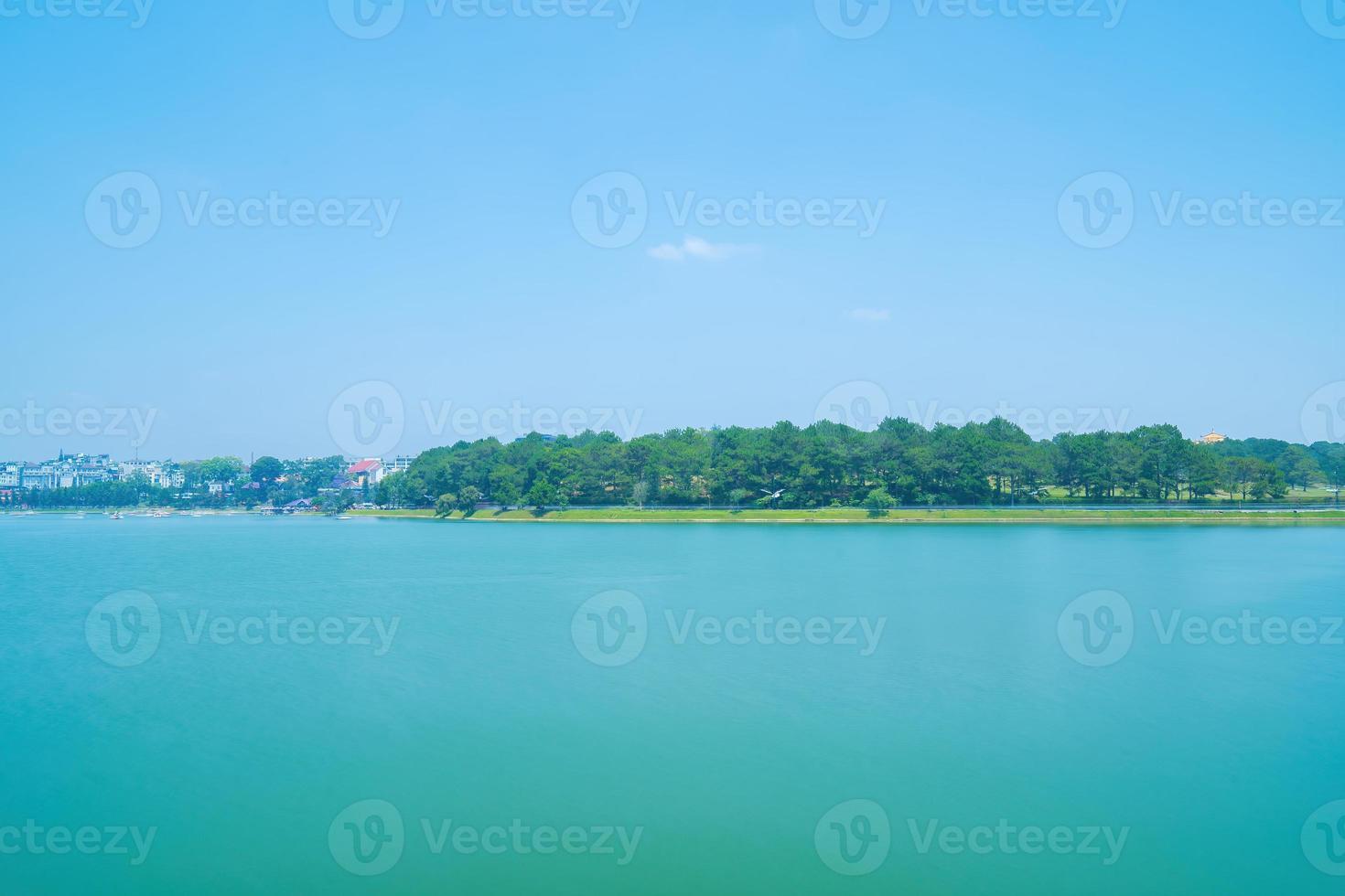 Fabulous sunrise by Xuan Huong Lake, in center Da Lat City, Lam Dong Province, Vietnam. This artificial lake in the city centre is a favourite place for tourists and locals for walking. photo