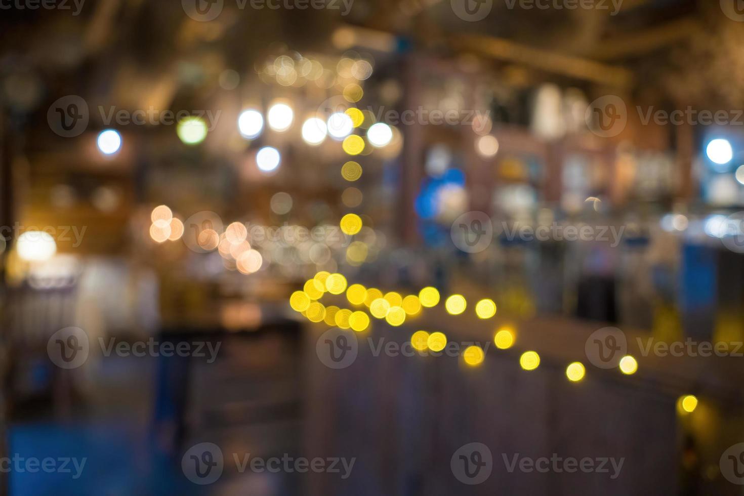 Blurred background Interior of cozy coffee shop. Contemporary design in loft style, modern dining place and bar counter, copy space. photo