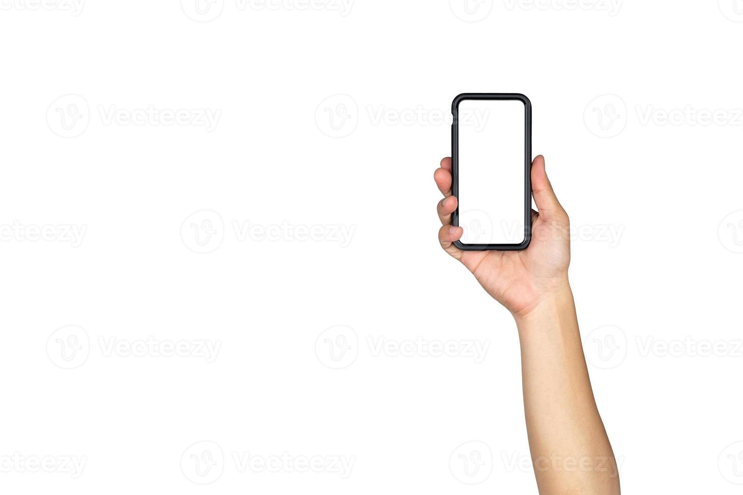 Asian Thai male isolated hand hold Smart mobile phone and raise up in vertical direction with empty copy space on white background. photo