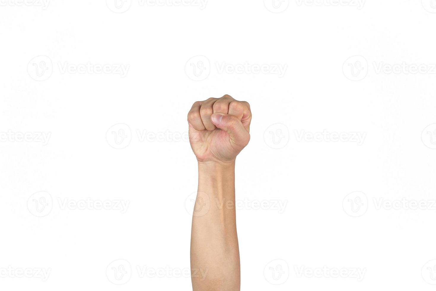 Asian Thai males tense fist and rise the isolated hand on the clear white background. photo