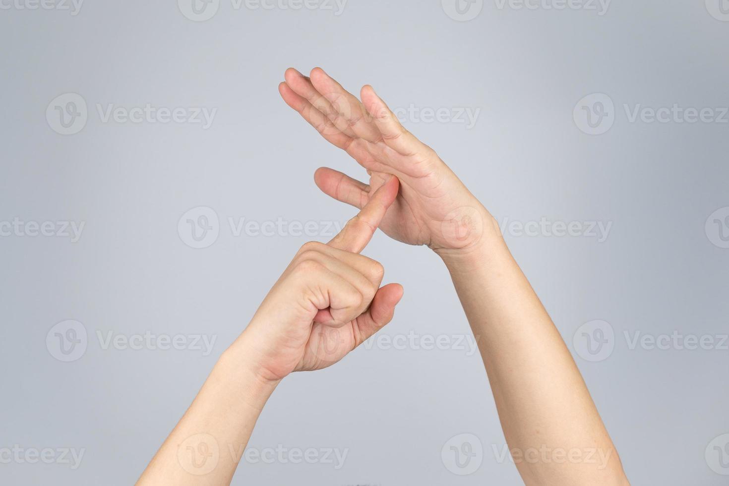 TimeOut sign and simbol from Asian human hand with isolate white background and clipping path. photo