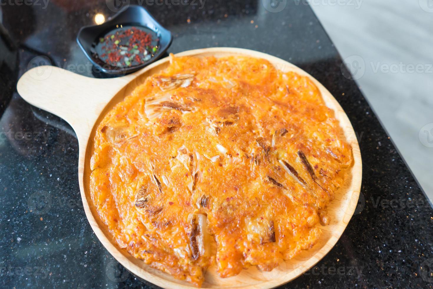 Korean food in modern applied kimchi with pizza merge together. photo
