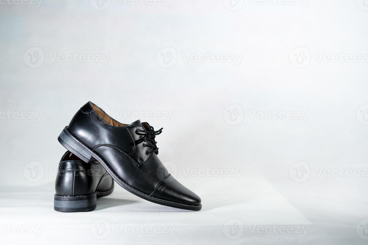 Luxuary man leather black shoe on the white isolation backtground. photo