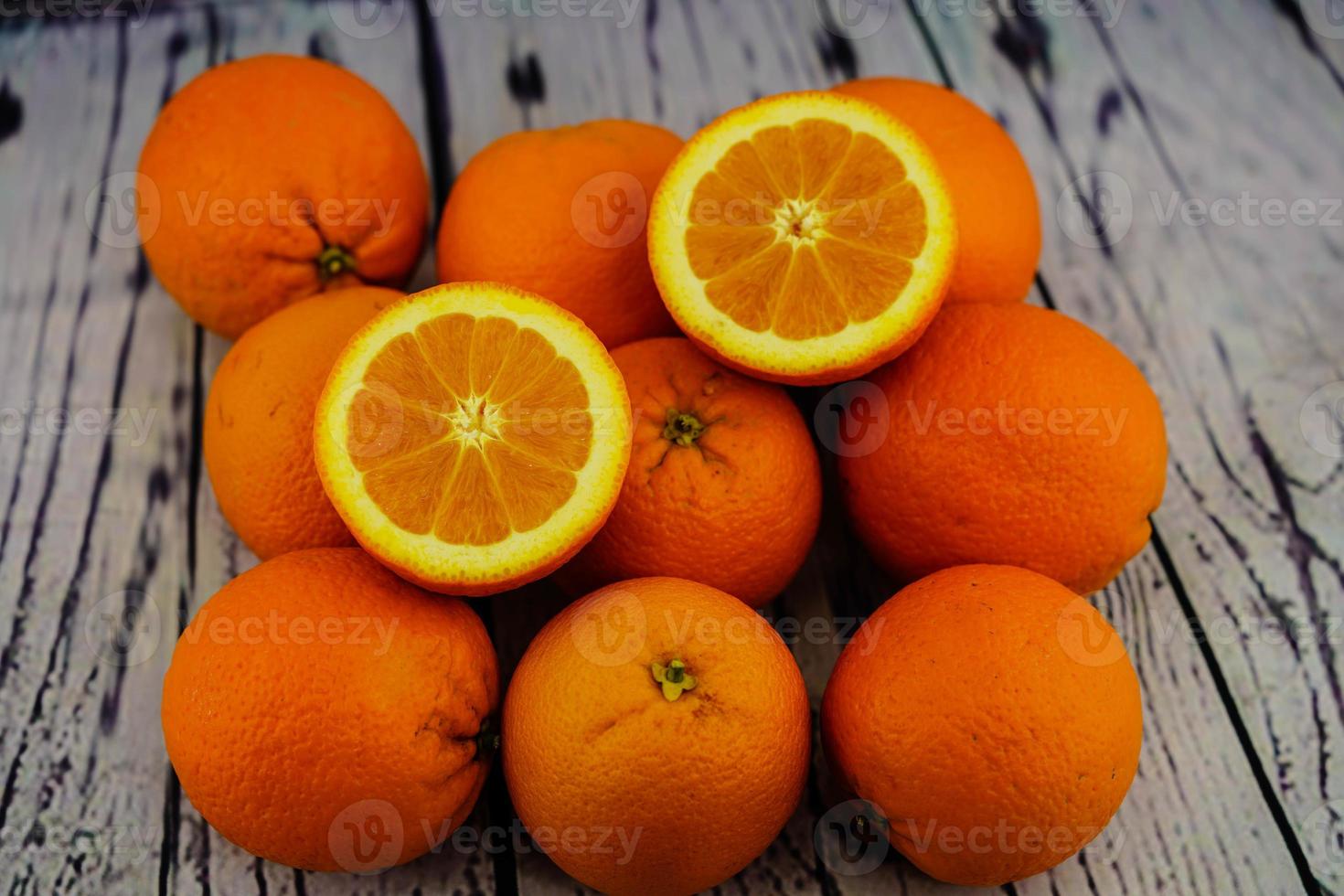 A stack of fresh sliced orange fruits photo