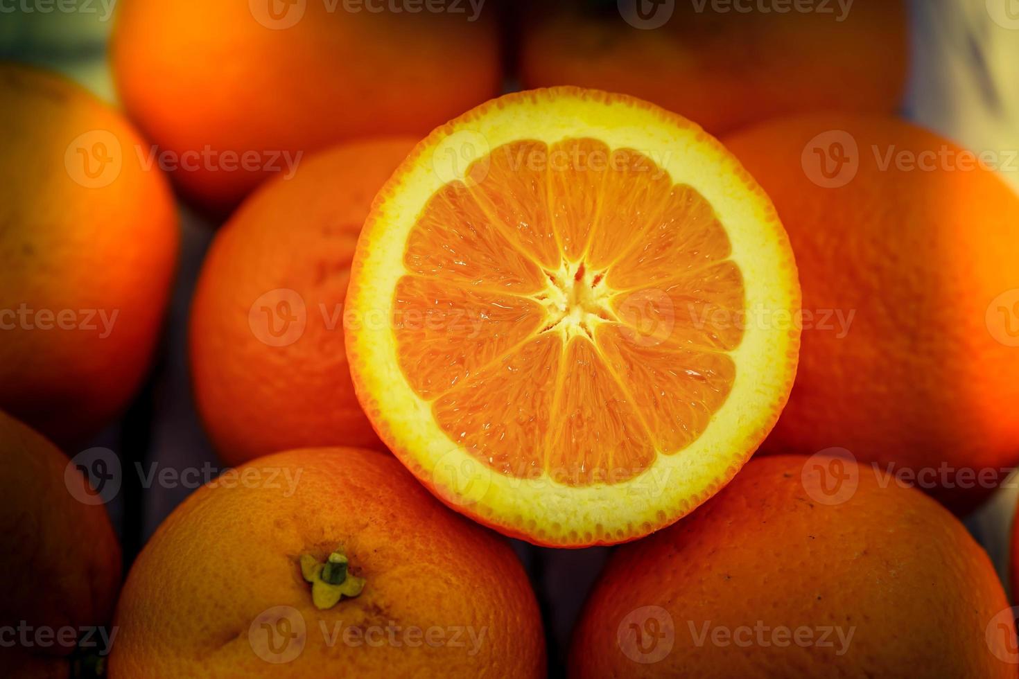 A stack of fresh sliced orange fruits photo