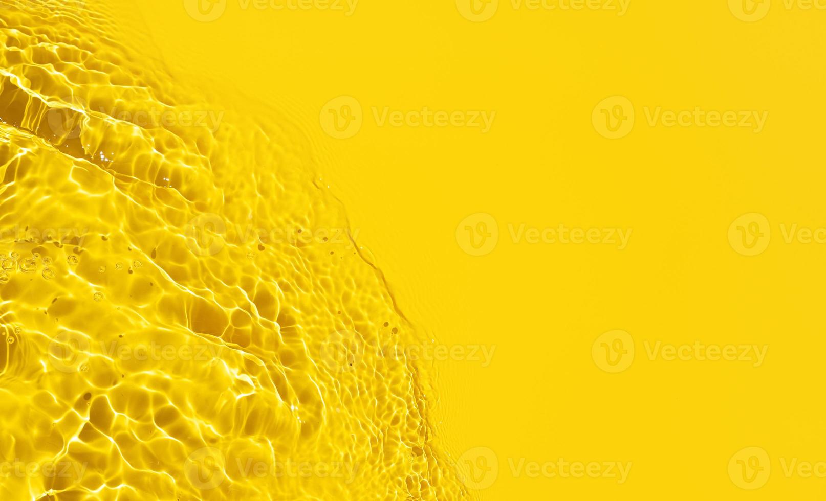 Yellow Abstract background texture with water ripples and waves. Copy space. Top view photo