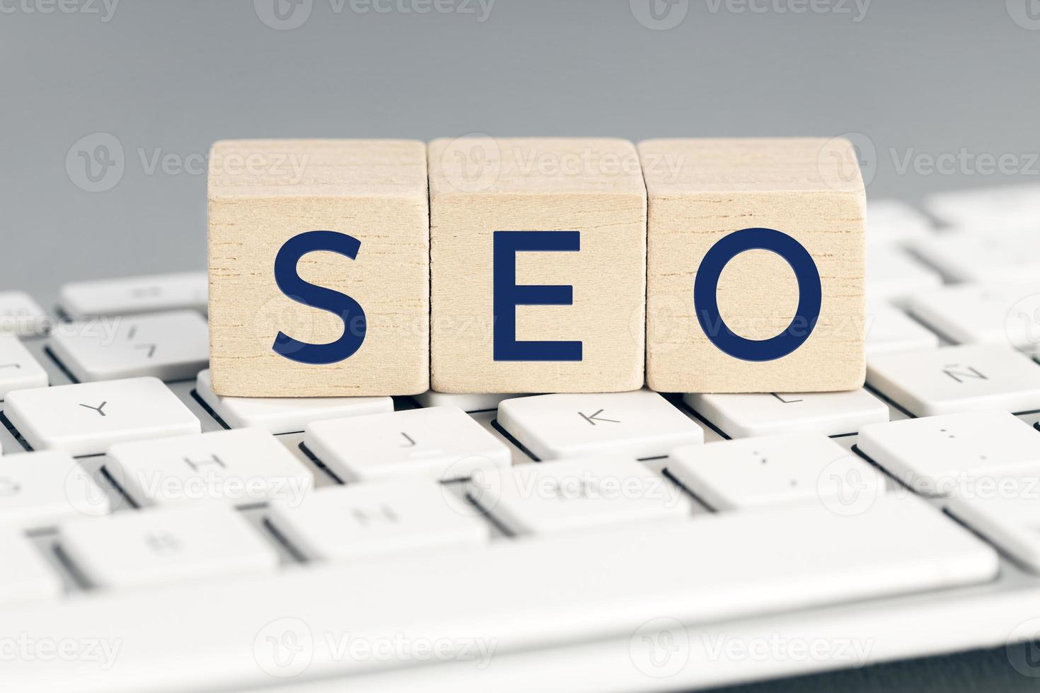 SEO word on wooden blocks on computer keyboard. Search Engine optimization concept photo