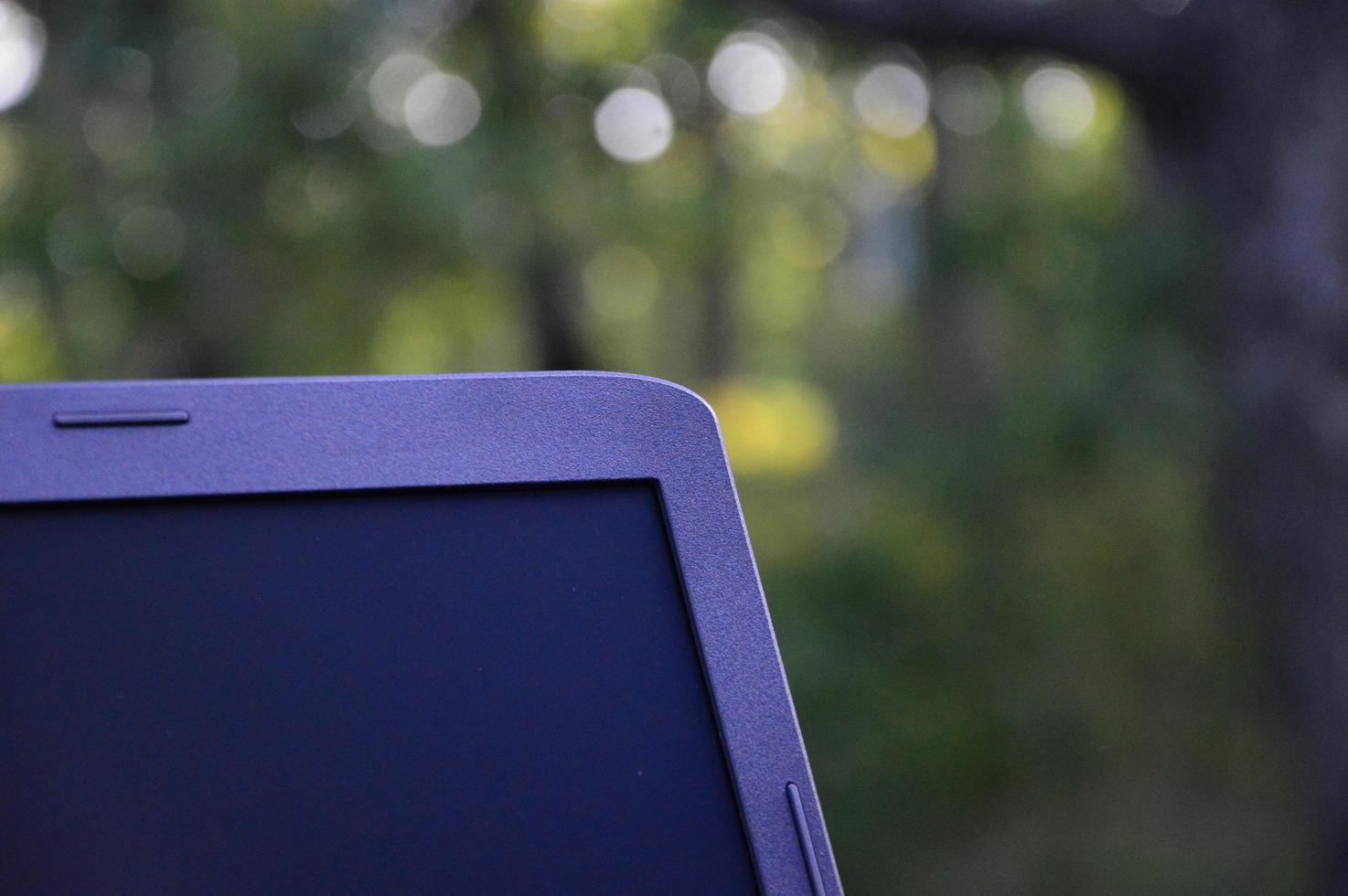 Laptop with garden background photo