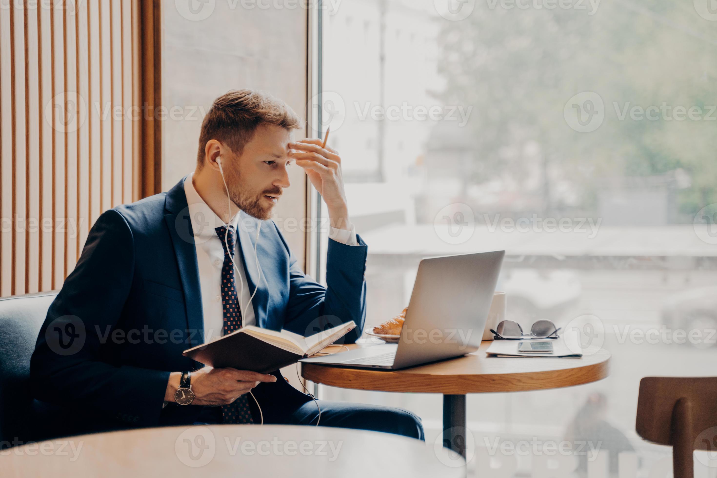 Side photo of successful business person busy working from coffee shop 8358107 Stock Photo at