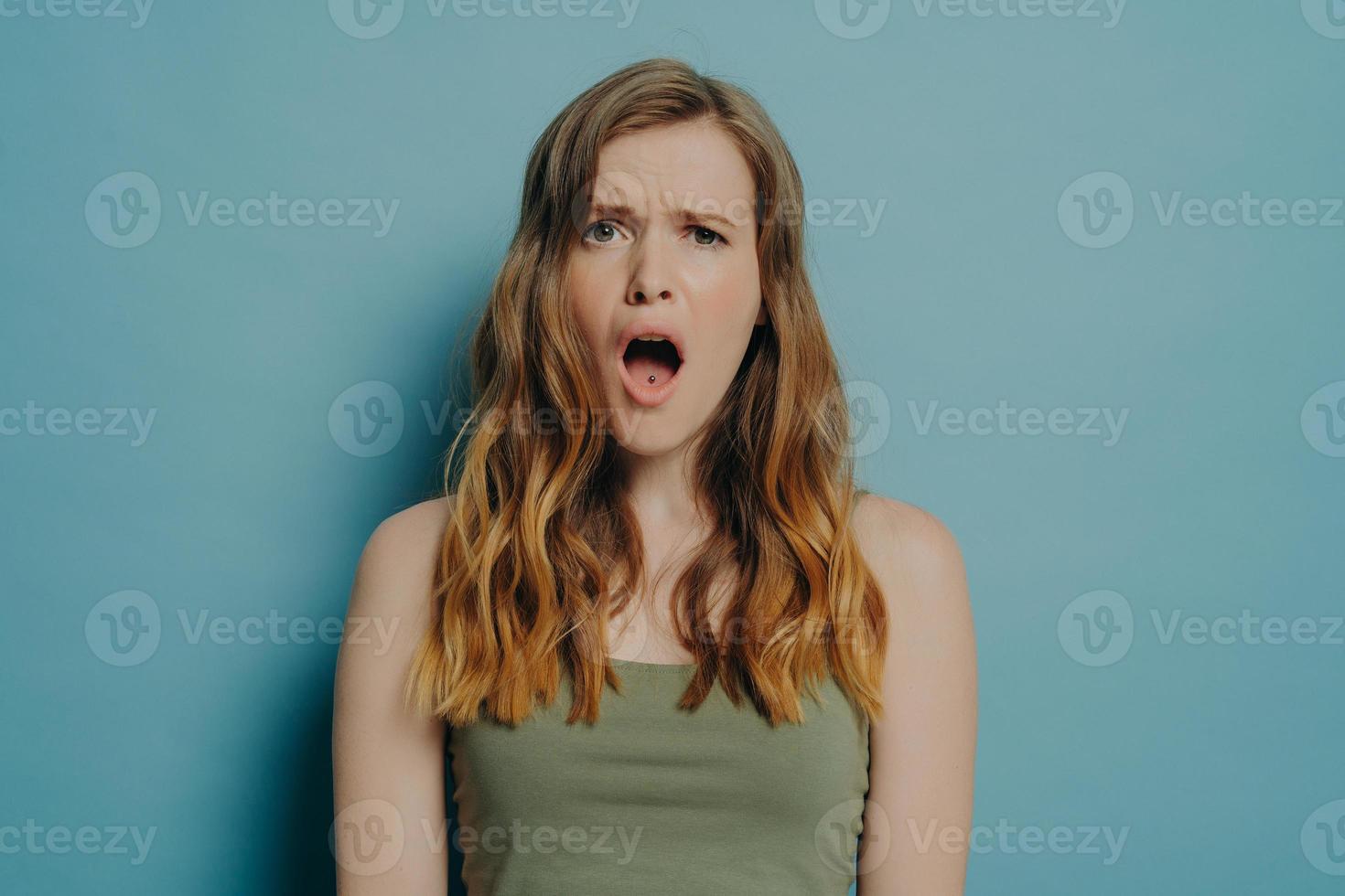 Young displeased woman with dissatisfied face expression and open mouth  seeing something ugly 8359615 Stock Photo at Vecteezy