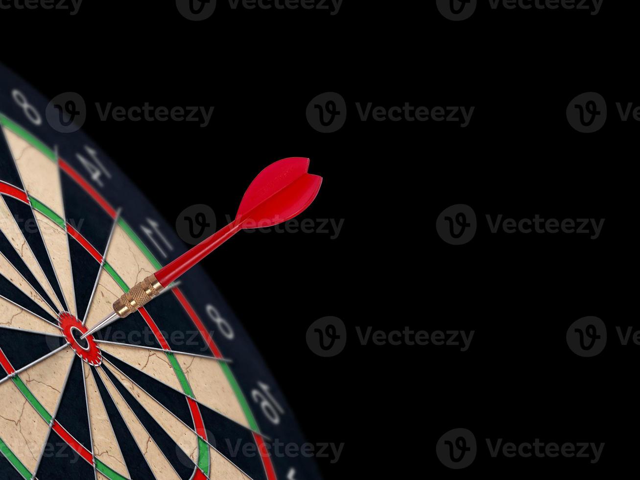 Red dart arrow on center of dartboard. Concept business target, success and win photo