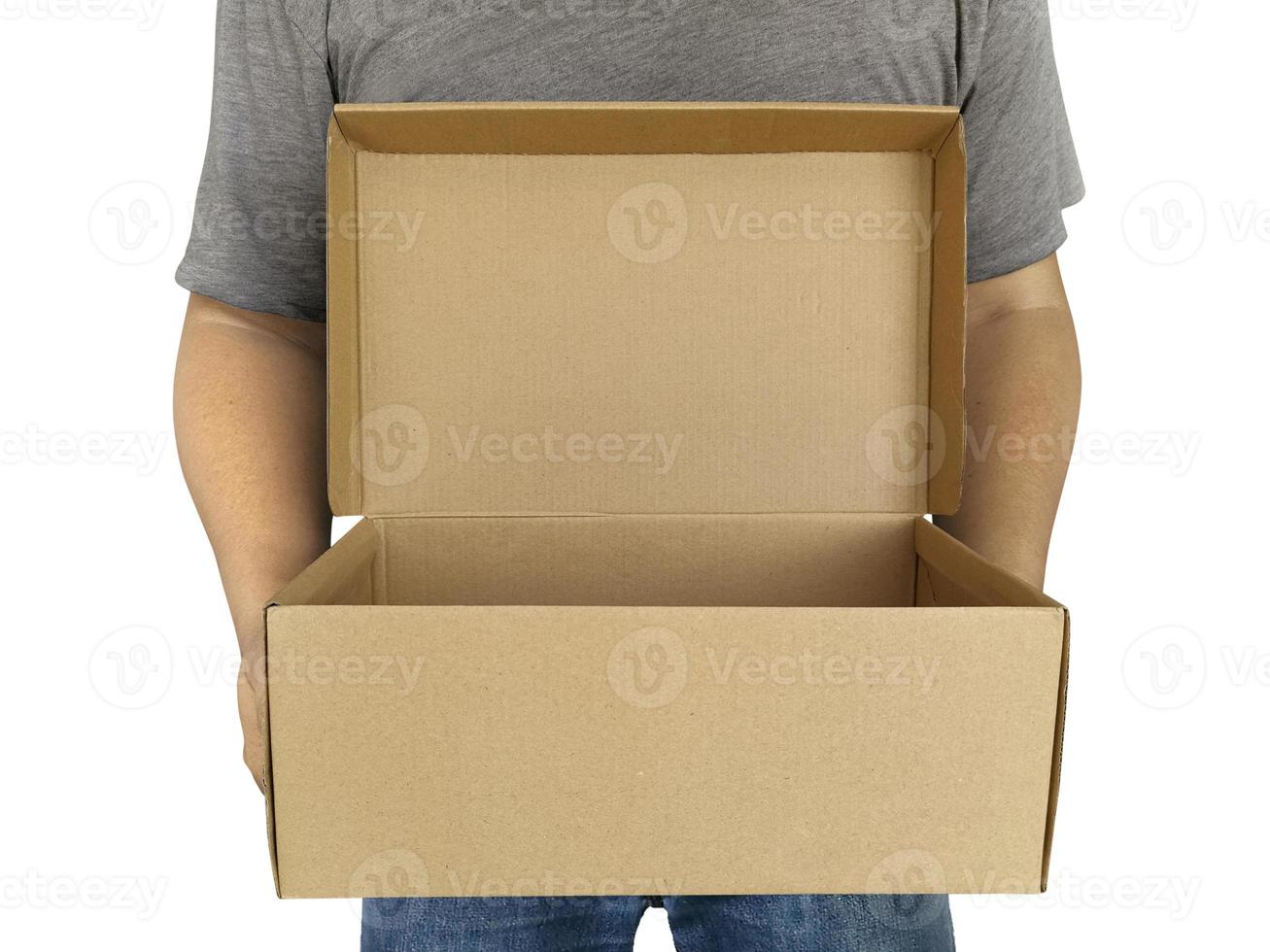 Delivery man holding cardboard boxes isolated on white photo