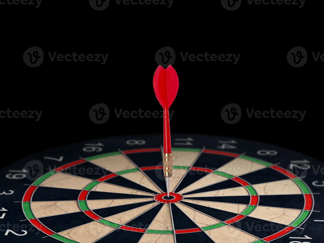 Red dart arrow on center of dartboard. Concept business target, success and win photo