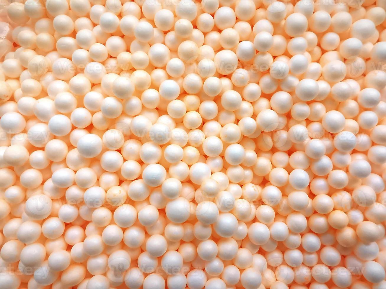 Background of white circle styrofoam ball pattern texture foam surface abstract background photo
