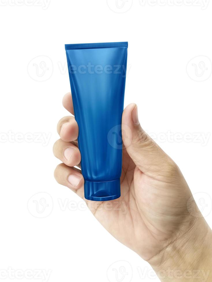 Hand holding Cosmetic plastic tube isolated on white background photo