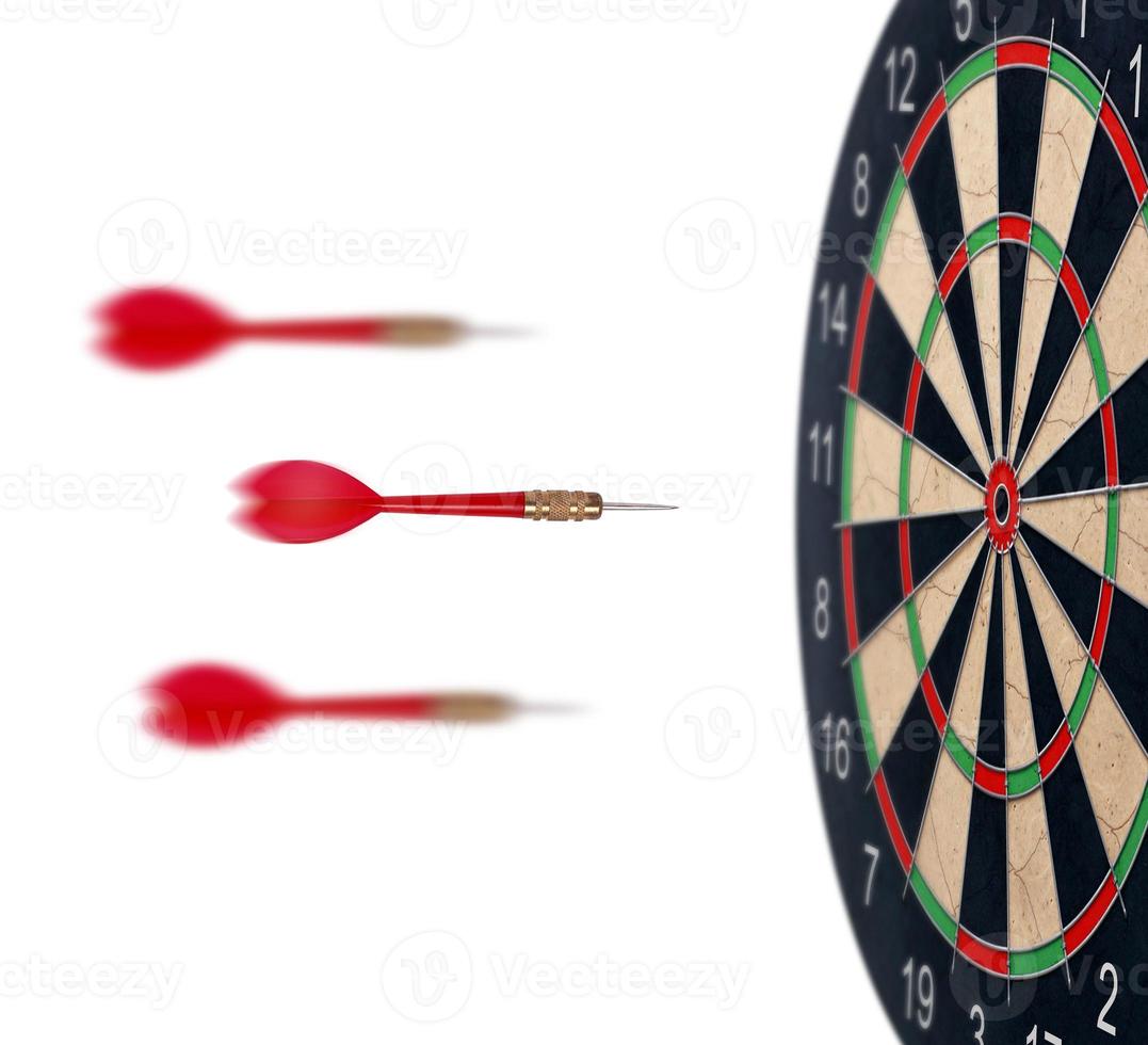 red dart arrows flying to target dartboard. Metaphor to target success, winner concept. Isolated on white background photo