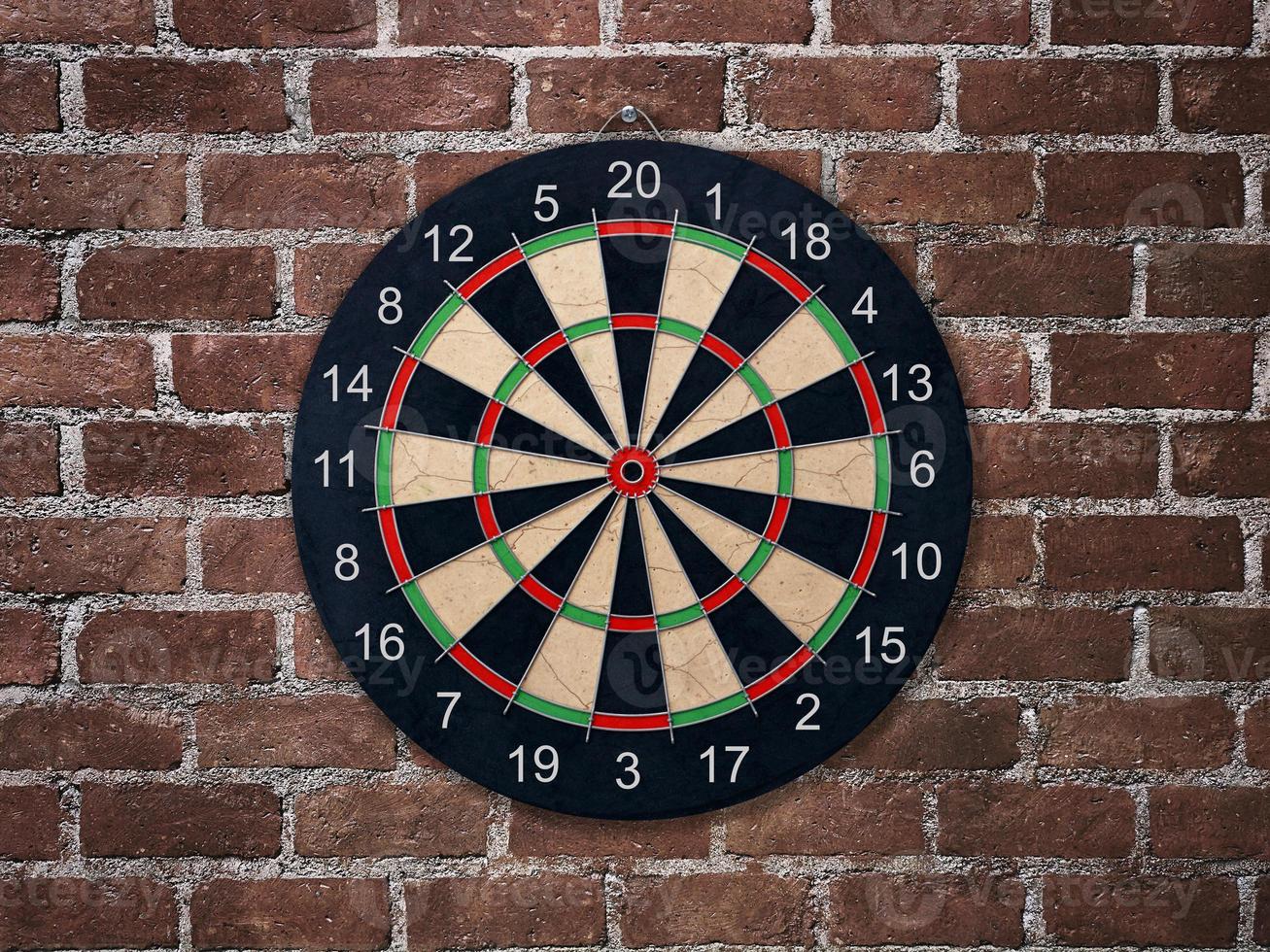 Target for Darts. Darts. red brick wall background photo