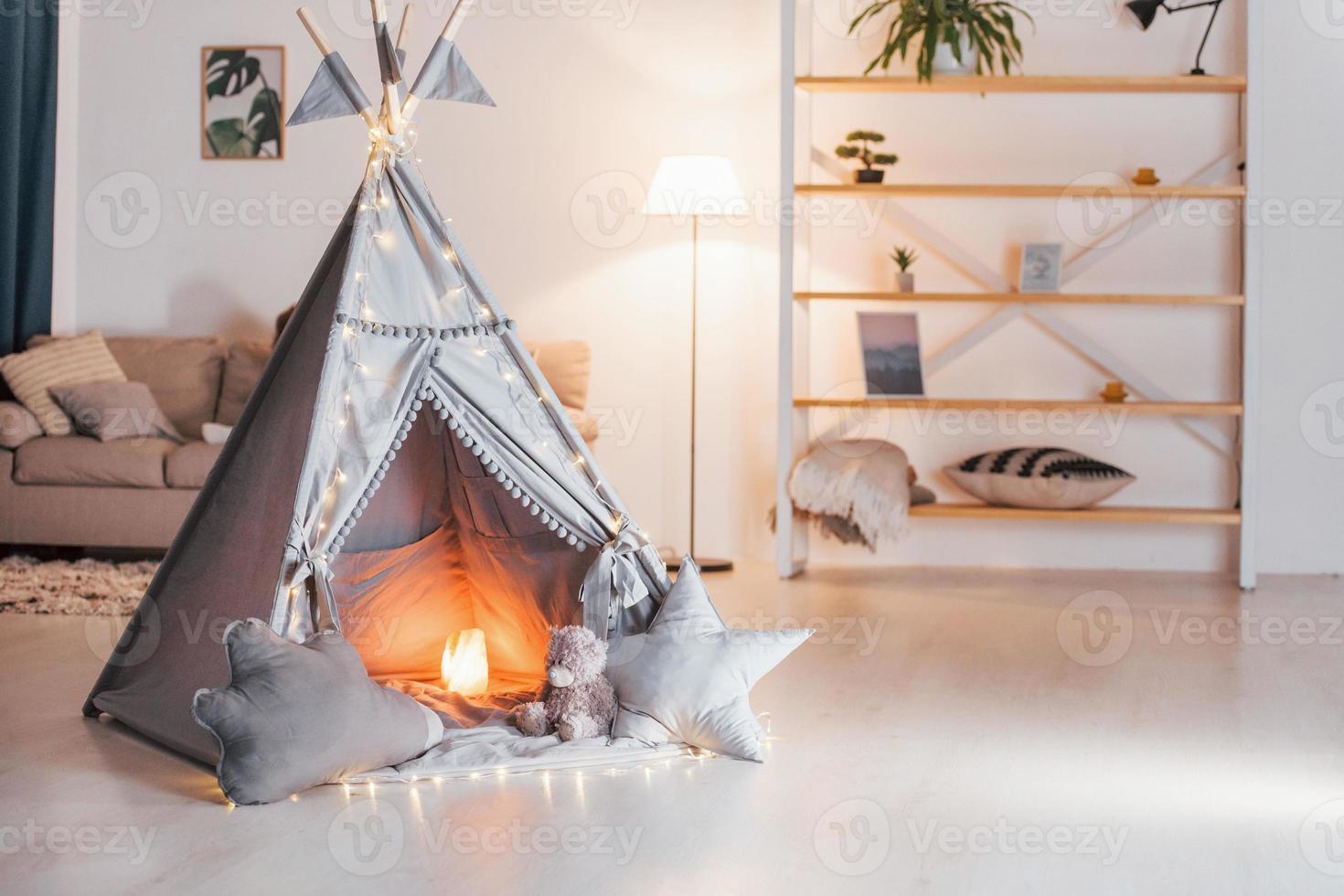 Tent with lamb in it is in the domestic room. No people photo