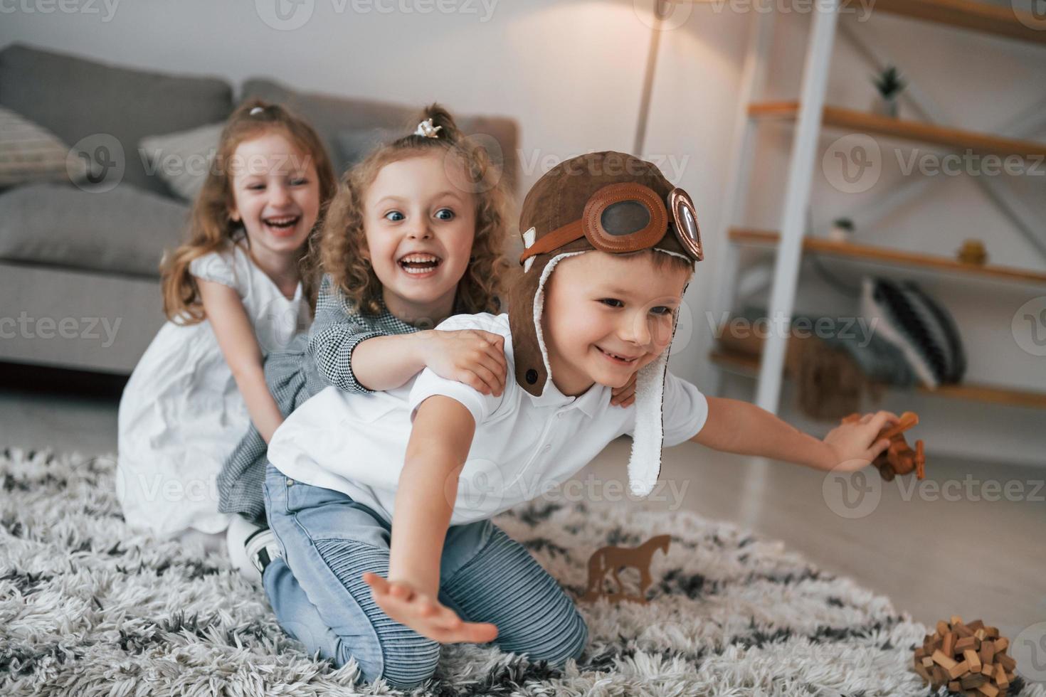 Playful mood. Tetro aviator glasses. Group of children is together at home at daytime photo