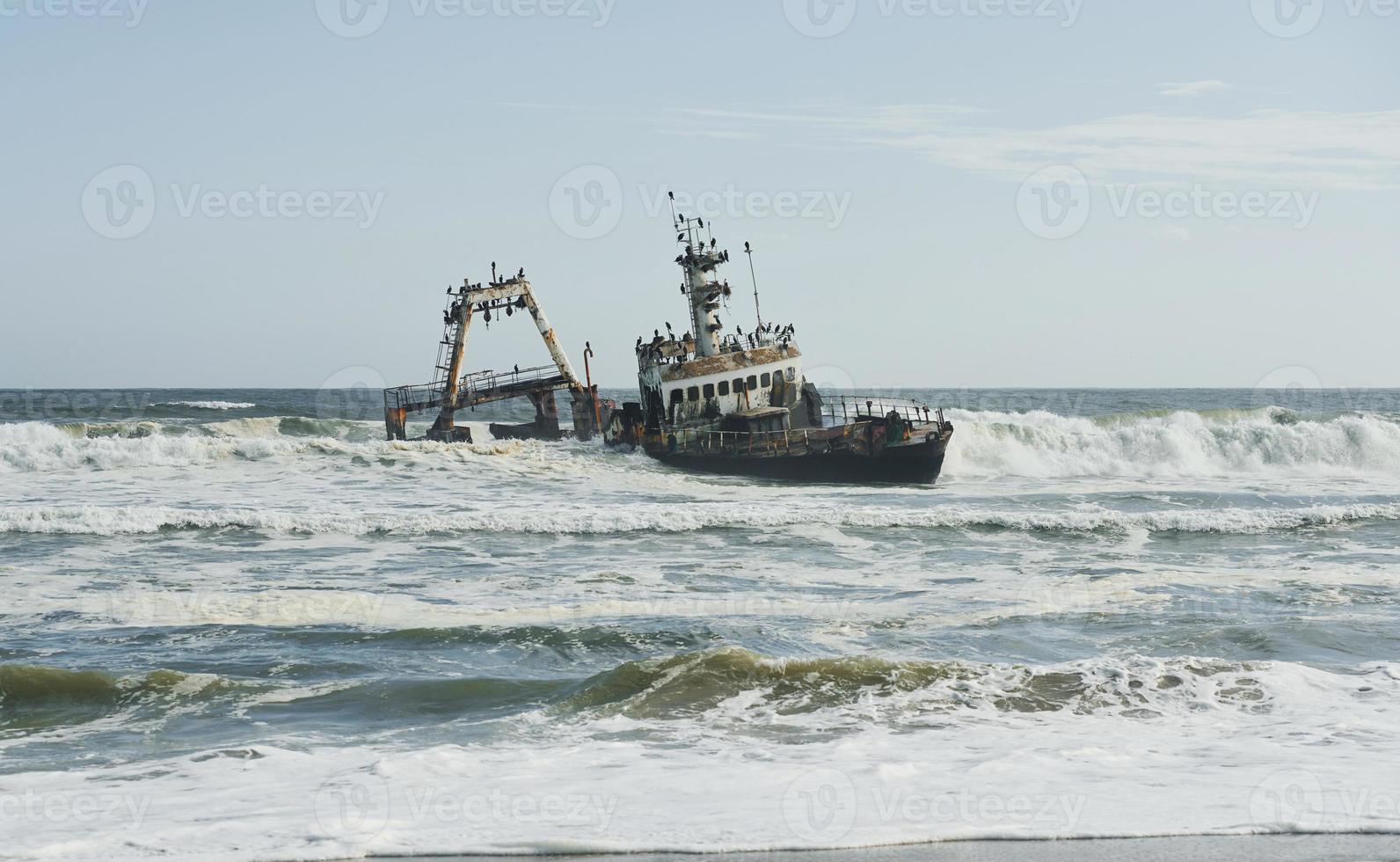 View of abandoned old drowned ship in the sea of Africa photo